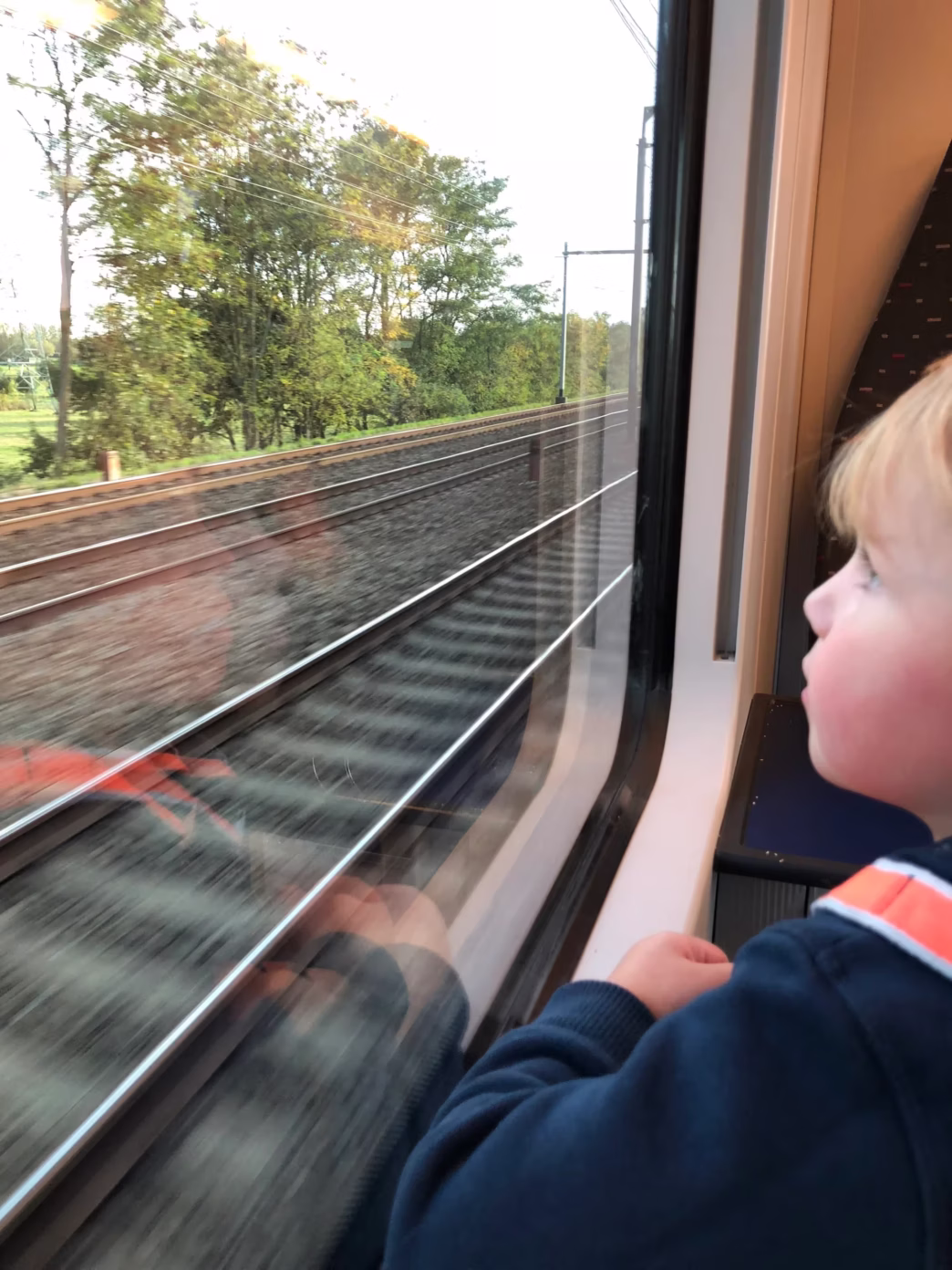 Boy looking out of train window