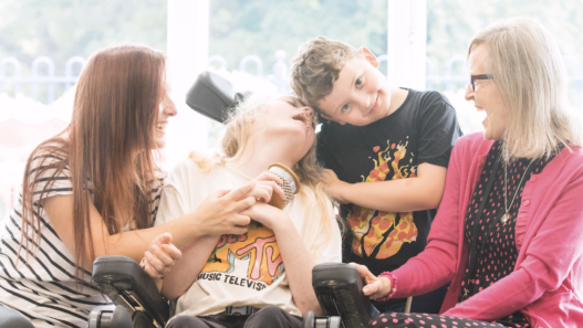 Disabled lady with her carers