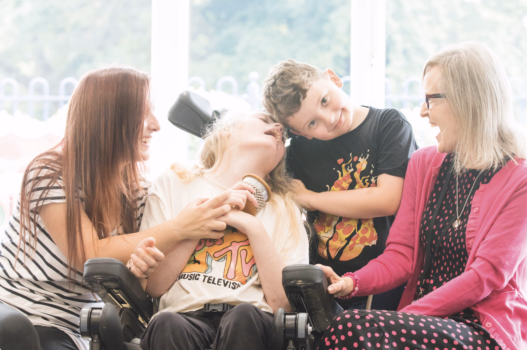 Disabled lady with her carers